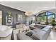 Well-appointed living area featuring modern furnishings, a decorative fireplace, and ample natural light at 10157 E San Salvador Dr, Scottsdale, AZ 85258
