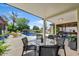 Inviting outdoor patio with dining table and a view of the sparkling pool at 10157 E San Salvador Dr, Scottsdale, AZ 85258