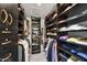 Organized walk-in closet with custom shelving, providing ample storage for clothing and accessories at 10157 E San Salvador Dr, Scottsdale, AZ 85258