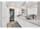 Bathroom with dual sinks, white cabinets, and a view into the tiled shower at 11260 N 92Nd St # 2054, Scottsdale, AZ 85260