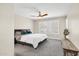 Cozy bedroom featuring neutral walls, fan, carpet floors, and plantation shutters for natural light at 11260 N 92Nd St # 2054, Scottsdale, AZ 85260