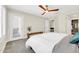 Bright bedroom showcasing a bed, sliding glass doors, wooden bench, and views of the dining area at 11260 N 92Nd St # 2054, Scottsdale, AZ 85260