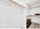 Walk-in closet offering ample storage space with shelving and wood flooring at 11260 N 92Nd St # 2054, Scottsdale, AZ 85260