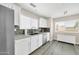 Well-lit kitchen with white cabinetry, stainless steel appliances, granite countertop, and a modern backsplash at 11260 N 92Nd St # 2054, Scottsdale, AZ 85260