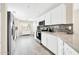 Spacious kitchen with modern stainless steel appliances, bright white cabinetry, and decorative backsplash at 11260 N 92Nd St # 2054, Scottsdale, AZ 85260