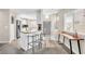 Bright kitchen with white cabinets, breakfast bar, stainless steel appliances, and modern lighting at 11260 N 92Nd St # 2054, Scottsdale, AZ 85260