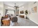 Bright living room featuring a stone fireplace and neutral-toned furnishings at 11260 N 92Nd St # 2054, Scottsdale, AZ 85260