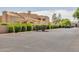 Wide view of condo parking lot with desert landscaping and plenty of parking spaces at 11260 N 92Nd St # 2054, Scottsdale, AZ 85260