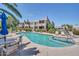 Community pool and spa area with lounge chairs and well-maintained landscaping on a sunny day at 11260 N 92Nd St # 2054, Scottsdale, AZ 85260