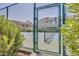 Community tennis court with a green chain-link fence, and lush green surroundings at 11260 N 92Nd St # 2054, Scottsdale, AZ 85260