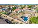 Aerial view of home with a pool, desert landscaping, and outdoor kitchen at 1443 N Poppy St, Casa Grande, AZ 85122