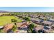 An aerial shot showcases this home with a view of backyard, pool and desert landscape at 1443 N Poppy St, Casa Grande, AZ 85122