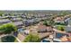 Aerial view of home with pool, patio, and desert landscaping in a residential neighborhood at 1443 N Poppy St, Casa Grande, AZ 85122
