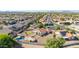 Aerial view of home with pool, patio, and desert landscaping in a residential neighborhood at 1443 N Poppy St, Casa Grande, AZ 85122