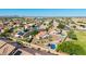 This aerial view showcases a home with a pool and desert landscaping at 1443 N Poppy St, Casa Grande, AZ 85122