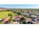 Neighborhood aerial view with desert landscaping, tile roofs, and mountain views at 1443 N Poppy St, Casa Grande, AZ 85122