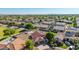 Aerial view showcasing homes with desert landscaping and tile roofs at 1443 N Poppy St, Casa Grande, AZ 85122