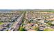 Stunning aerial view of a lovely home with a pool and landscaped yard, in a Gathering-friendly neighborhood at 1443 N Poppy St, Casa Grande, AZ 85122