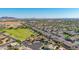 Aerial view of a residential neighborhood with homes situated near a park at 1443 N Poppy St, Casa Grande, AZ 85122