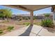 Spacious backyard featuring a gazebo, lush plants, and a concrete patio, perfect for outdoor living at 1443 N Poppy St, Casa Grande, AZ 85122
