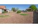 Expansive backyard with desert landscaping, barbecue area, pool, and covered patio, creating an entertainer's dream at 1443 N Poppy St, Casa Grande, AZ 85122
