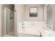 Bathroom showcasing a shower and soaking tub at 1443 N Poppy St, Casa Grande, AZ 85122