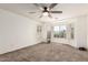 Bright bedroom with a ceiling fan and large windows providing natural light at 1443 N Poppy St, Casa Grande, AZ 85122