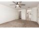 Bedroom with a ceiling fan and ensuite bathroom and a large closet at 1443 N Poppy St, Casa Grande, AZ 85122