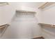 Walk-in closet with built-in shelving and ample storage space at 1443 N Poppy St, Casa Grande, AZ 85122