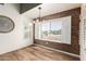 Bright dining room featuring hardwood floors, plantation shutters and modern light fixtures at 1443 N Poppy St, Casa Grande, AZ 85122