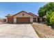Charming single-story home featuring a terracotta roof, neutral stucco, and a spacious three-car garage at 1443 N Poppy St, Casa Grande, AZ 85122