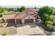 Stunning single-Gathering home with two-car garage, tile roof, and desert landscaping at 1443 N Poppy St, Casa Grande, AZ 85122