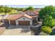 Charming single-Gathering home with a three-car garage and well-maintained landscaping at 1443 N Poppy St, Casa Grande, AZ 85122