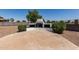Outdoor kitchen featuring a built-in BBQ grill and paved patio area at 1443 N Poppy St, Casa Grande, AZ 85122