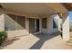 Covered patio with sliding glass door and windows, providing a comfortable outdoor space at 1443 N Poppy St, Casa Grande, AZ 85122