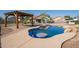 Stunning pool area with a covered pergola, creating a serene outdoor oasis at 1443 N Poppy St, Casa Grande, AZ 85122