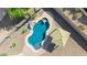 Aerial view of a backyard pool with a rock feature, waterfall, and gazebo at 1443 N Poppy St, Casa Grande, AZ 85122