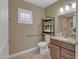 Accessible bathroom features granite countertops, accessible toilet and safety bars at 15803 W Almeria Rd, Goodyear, AZ 85395