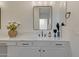 Elegant bathroom vanity with decorative accents and stylish lighting at 15803 W Almeria Rd, Goodyear, AZ 85395