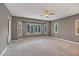 Large bedroom with a wall of windows that bathes the room in natural light at 15803 W Almeria Rd, Goodyear, AZ 85395
