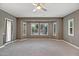 Bright and airy bedroom featuring a bay window overlooking the backyard oasis at 15803 W Almeria Rd, Goodyear, AZ 85395