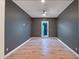 Bedroom with hard wood flooring, neutral walls, and ceiling fan at 15803 W Almeria Rd, Goodyear, AZ 85395