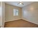 Bedroom with carpet and shuttered window with a feature wall at 15803 W Almeria Rd, Goodyear, AZ 85395