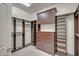 Spacious walk-in closet with custom shelving, drawers, and ample storage space at 15803 W Almeria Rd, Goodyear, AZ 85395