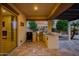 Inviting outdoor kitchen area, complete with a built-in grill, perfect for entertaining at 15803 W Almeria Rd, Goodyear, AZ 85395