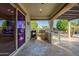 Inviting outdoor kitchen area, complete with a built-in grill, perfect for entertaining at 15803 W Almeria Rd, Goodyear, AZ 85395