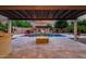 Stunning outdoor pool area with a built-in fire pit, perfect for entertaining at 15803 W Almeria Rd, Goodyear, AZ 85395
