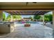 Stunning outdoor pool area with a built-in fire pit, perfect for entertaining at 15803 W Almeria Rd, Goodyear, AZ 85395