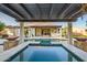 Stunning pool featuring a spa, travertine surround, and fire bowls, ideal for outdoor entertaining at 15803 W Almeria Rd, Goodyear, AZ 85395