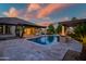 This home has a pool, spa, outdoor kitchen, and covered patios at 15803 W Almeria Rd, Goodyear, AZ 85395